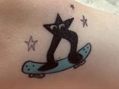 a person with a tattoo on their back that has a skateboard in the shape of a star