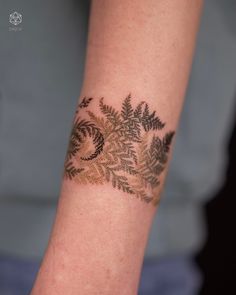 a person with a tattoo on their arm