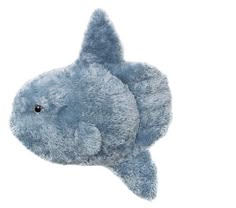 a blue stuffed fish on a white background with clippings to it's side
