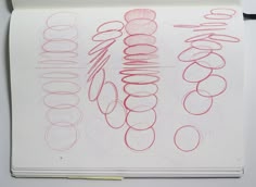 a notebook with some drawings on top of it