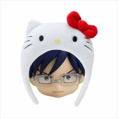 a hello kitty doll with glasses and a red bow on it's head is shown