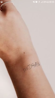 a person's arm with a tattoo that reads, ehosb on it