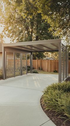 an outdoor covered area with trees and bushes