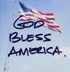 an american flag with the words god, bless america written in black ink