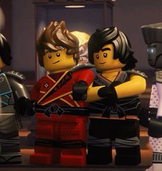 the lego movie characters are standing together