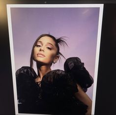 an image of a woman with her hair blowing in the wind on a purple background