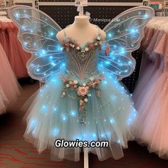 a blue fairy dress on display in a store