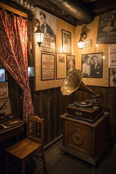an old fashioned record player is in the corner of a room with posters on the wall