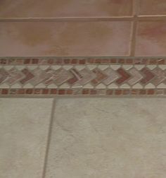 a white toilet sitting on top of a tiled floor