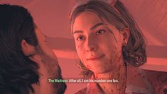 a woman with blood all over her face talking to a man in a red room