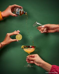 several people holding glasses filled with drinks and sprinkled with limes, on a green background