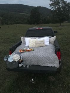 a bed in the back of a pick up truck