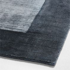 an area rug with grey and black colors