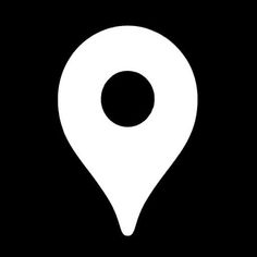 a black and white map pin with a circle in the middle on a dark background