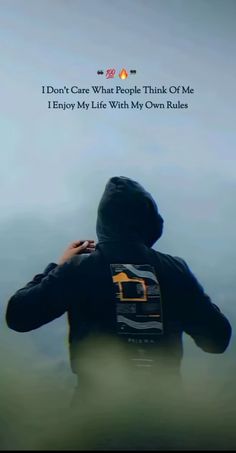 a person standing in front of a blue sky with the words i don't care what people think of me enjoy my life with my own rules
