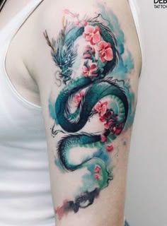 a woman with a dragon tattoo on her arm