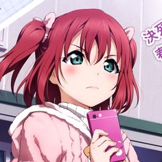 a girl with pink hair holding a cell phone