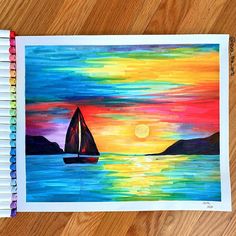a painting of a sailboat on the water at sunset with colored pencils in front of it