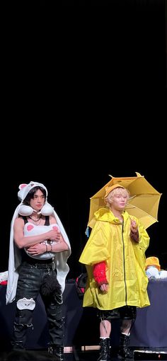 two people dressed in costumes standing next to each other