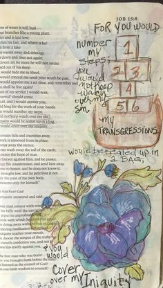 an open bible with flowers and numbers on it