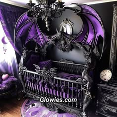 a purple and black bedroom with an ornate crib
