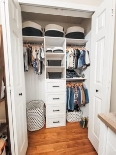 an organized closet with clothes, shoes and other items in it's storage area