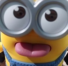 a close up of a minion with big eyes