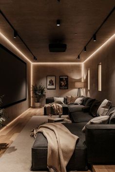 a living room filled with furniture and a flat screen tv mounted to the side of a wall
