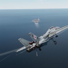 a fighter jet flying over the ocean next to an aircraft carrier