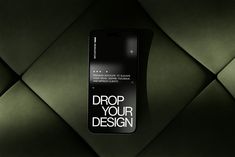 a cell phone with the words drop your design on it's back side, against a green background