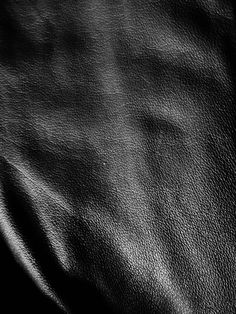black and white photograph of a leather textured material that looks like something out of space