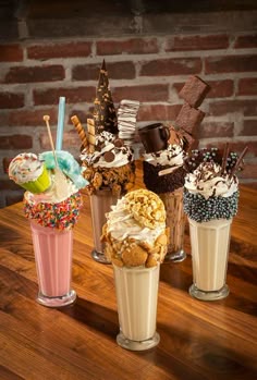 three different desserts and drinks on a table