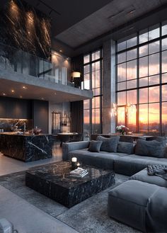 a living room filled with furniture and large windows