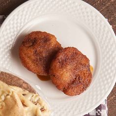 two fried food items on a white plate