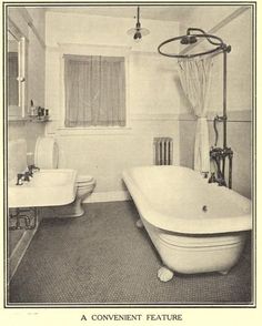 an old black and white photo of a bathroom with tub, sink, toilet and shower