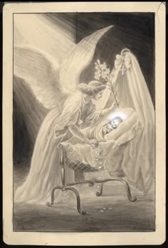 an angel sitting on top of a chair next to a baby