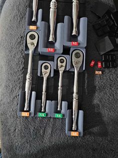 there are many wrenches and other tools on the table