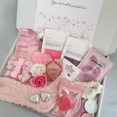 a pink gift box filled with lots of love and goodies for someone's special day