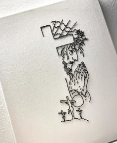 a black and white drawing of a person holding their hands up in front of a cross