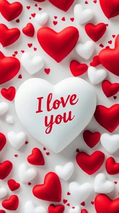 red and white hearts with the words i love you written on one of it's sides