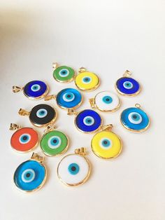 Round Evil Eye Jewelry Gift, Evil Eye Round Beads Jewelry For Friendship, Traditional Blue Evil Eye Jewelry, Evil Eye Beads For Jewelry, Spiritual Round Evil Eye Jewelry, Handmade Evil Eye Beads, Evil Eye Glass Pendant, Multicolor Round Evil Eye Jewelry, Artisanal Evil Eye Bead Tutorials