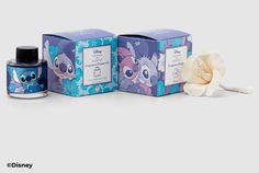 an opened box next to a flower and some kind of container with something in it