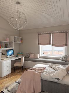 a bedroom with a bed, desk and computer