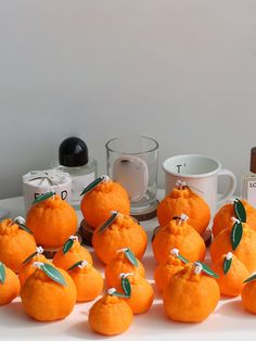 there are many oranges that have been made to look like they are sitting on the table