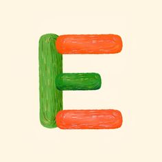 the letter e is drawn with colored crayons on paper, and it looks like carrots