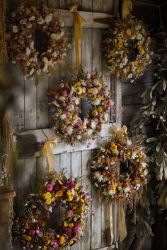 several wreaths are hanging on the wall