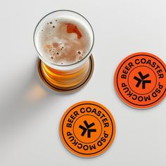 two beer coasters and a pint of beer
