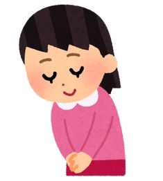 a woman with her eyes closed standing in front of a white background and wearing a pink sweater