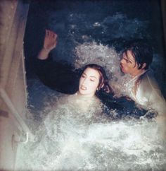 a man and woman are in the water