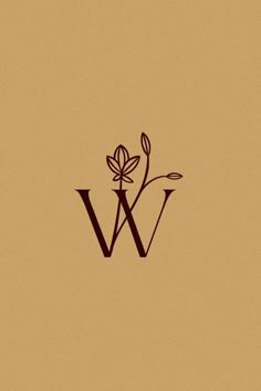 the letter w is made up of two leaves and a flower on top of it